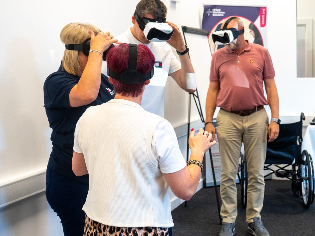 Learners with visual impaiment goggles, experiencing what it may feel like to live with dementia - At Ethical Workforces Trying Center in Ellesmere Port